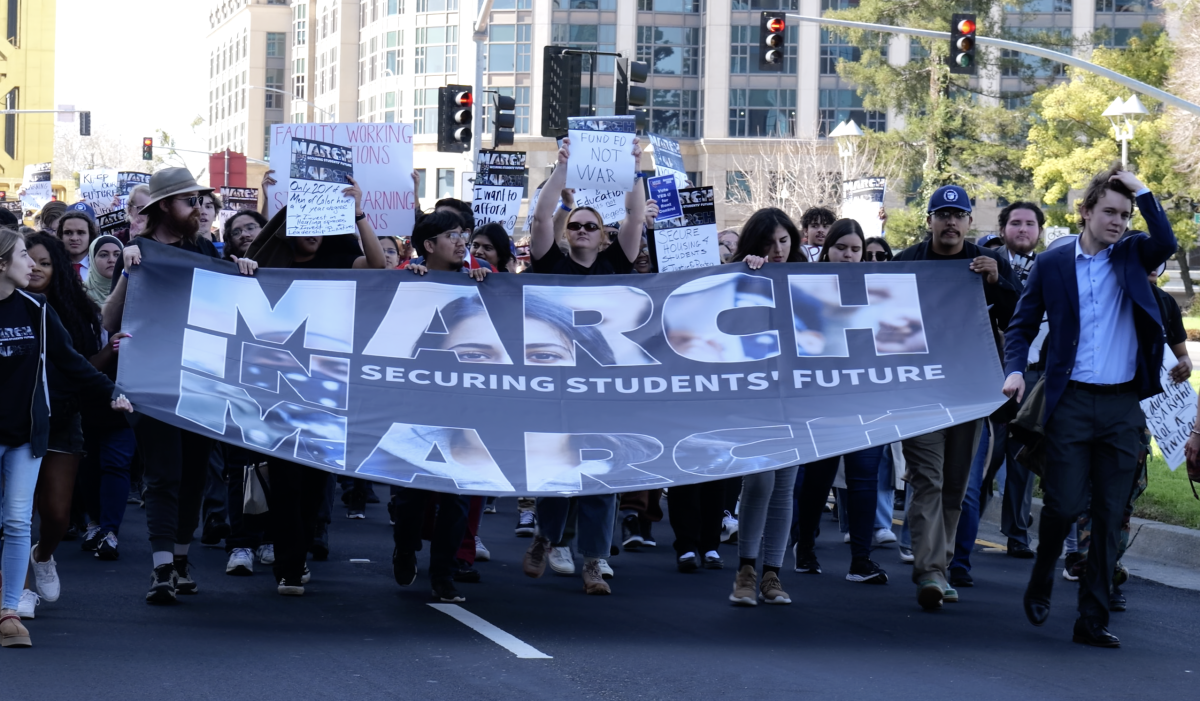 Hundreds of students and faculty members march east down Capitol Mall Boulevard in Sacramento toward the California State Capitol on March 7. The "March in March" event is a movement calling for changes in higher education and promoting environmental justice.